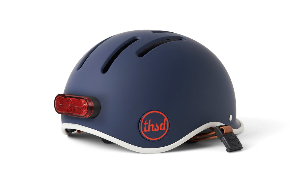 Thousand magnetic helmet light mounted on the back of a Heritage 2.0 helmet