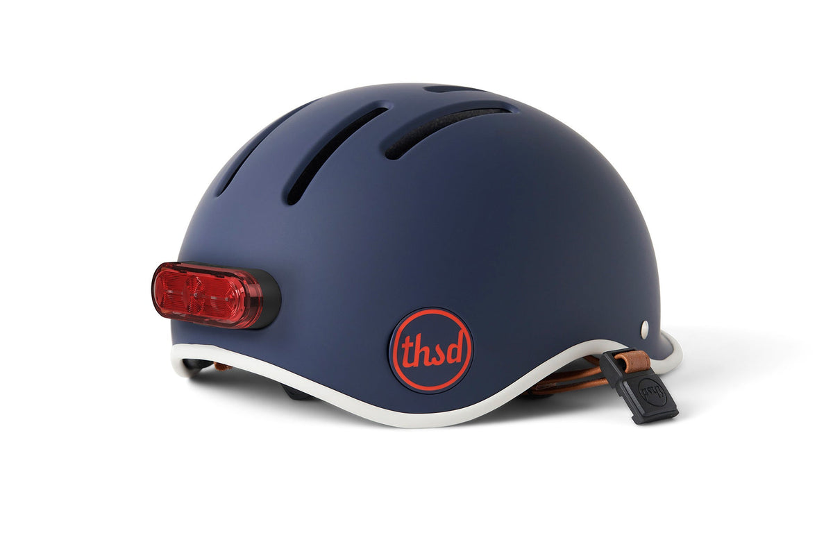 Thousand magnetic helmet light mounted on the back of a Heritage 2.0 helmet