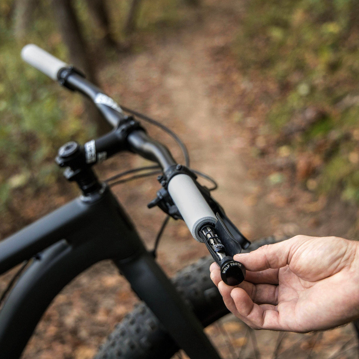Wolf Tooth EnCase System Bar Kit One, tool being pulled out of a mountain bike handlebar