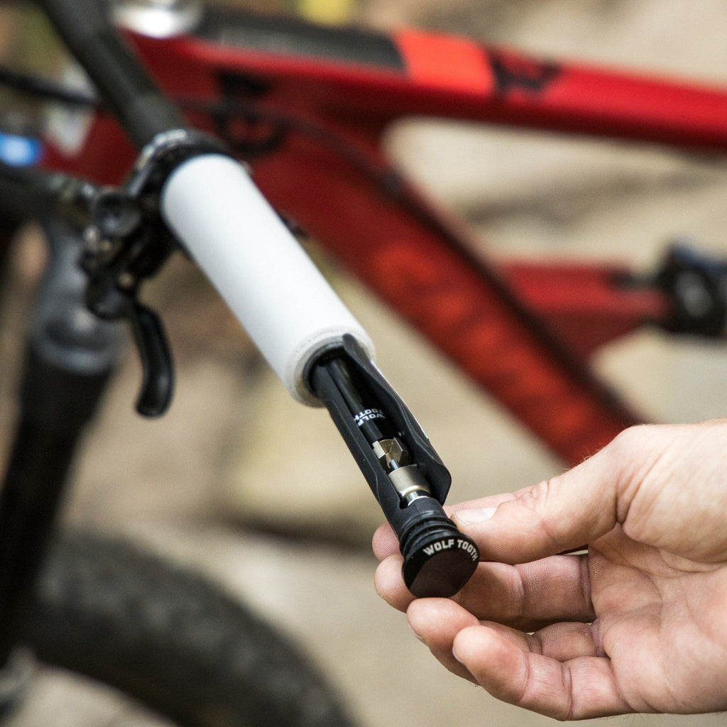 Wolf Tooth EnCase System Bar Kit One, tool being removed from the handlebar end, close-up