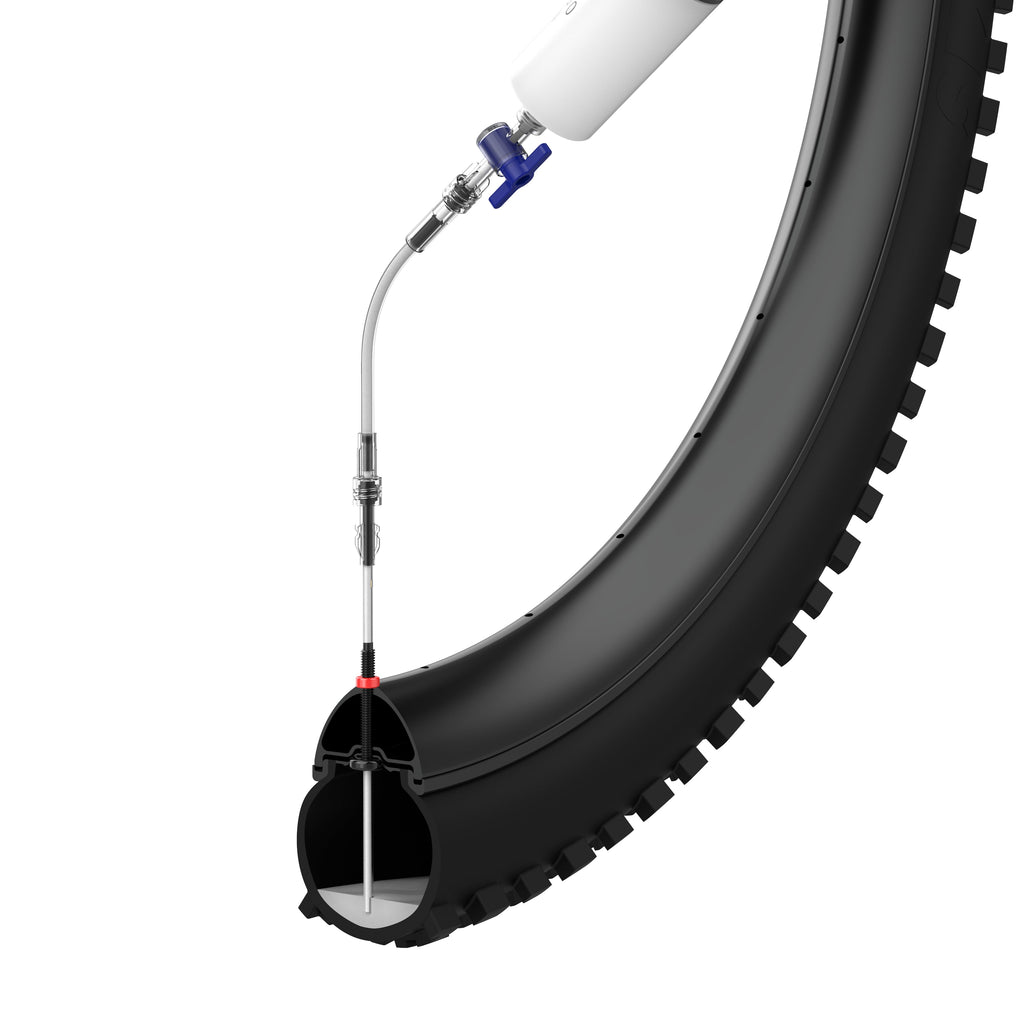 KOM Tubeless Sealant Injector, cutaway of sealant being injected into a tire