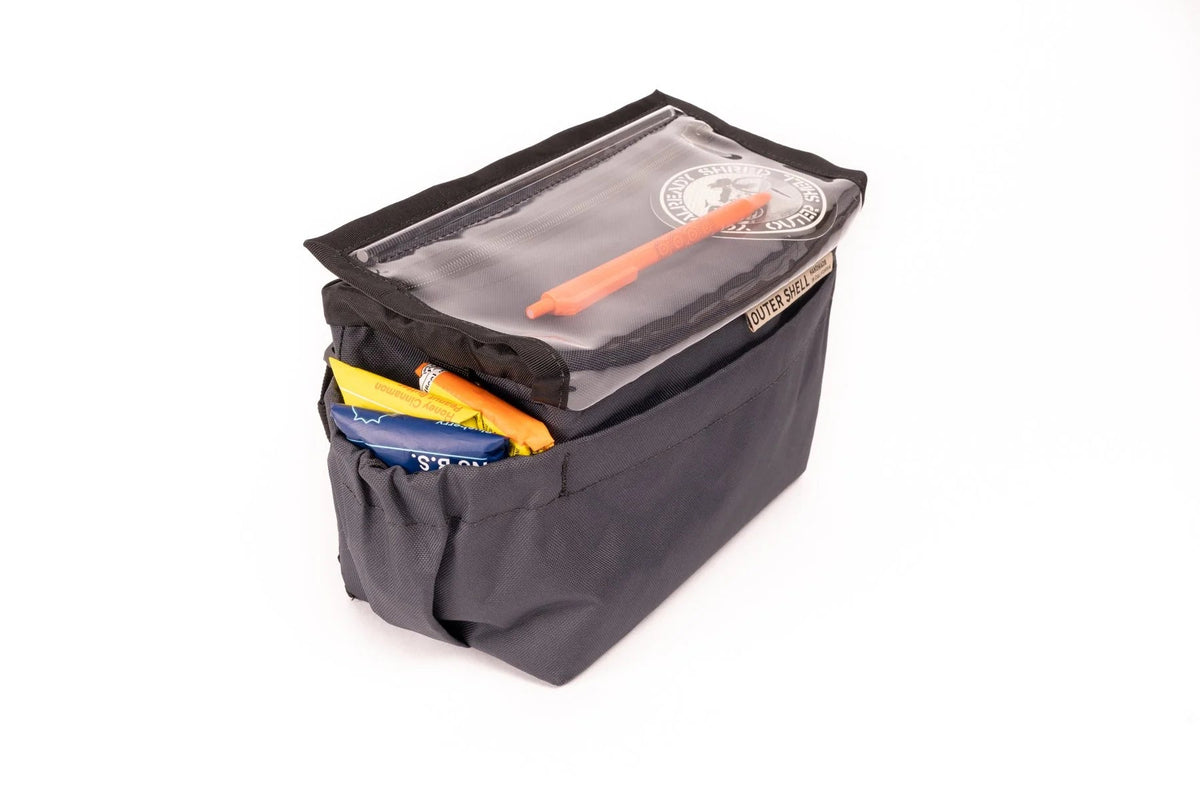 Outer Shell Drawcord Handlebar Bag, gray, with items under the clear flap