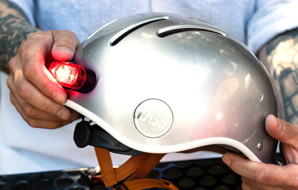 Magnetic Helmet Light, being attached to the back of a silver helmet