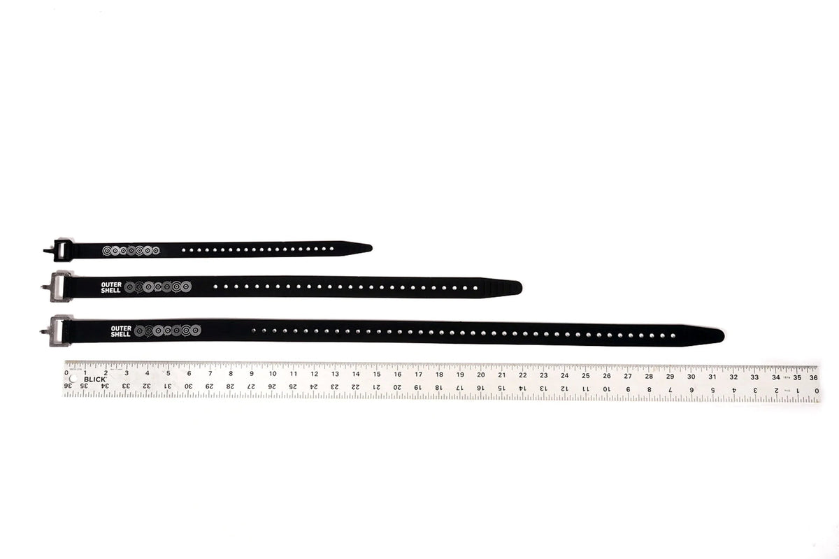 Outer Shell Logo Voilé Strap, three lengths next to a ruler