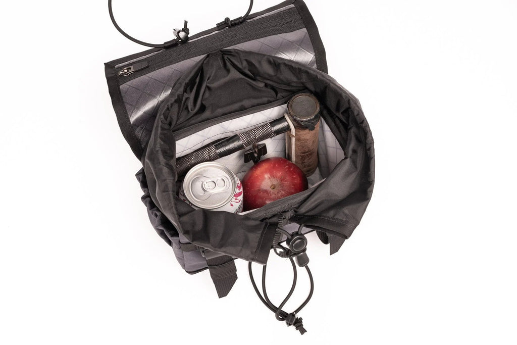 Outer Shell Drawcord Handlebar Bag, open with cans and snacks inside