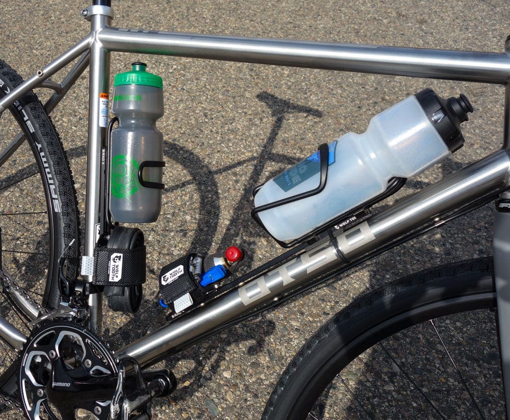 Wolf Tooth B-RAD Mounting Base, two bottles and a pump mounted on a gravel bike