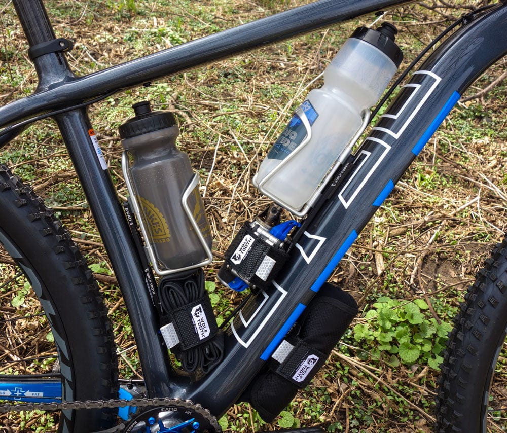 Wolf Tooth B-RAD Mounting Base, two bottles and a strap mounted on a mountain bike