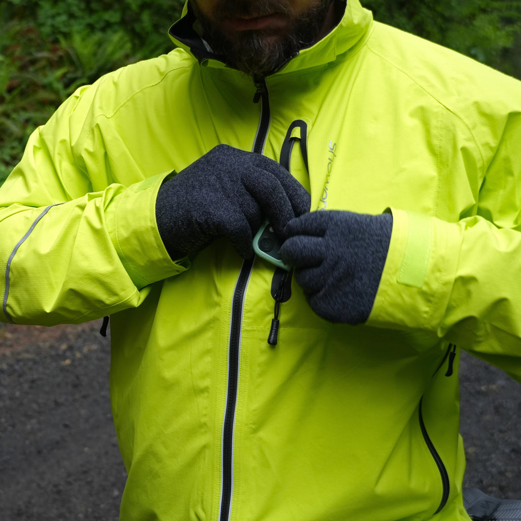 Men's Century Jacket, hi-vis yellow, rider using the chest zipper with gloves on