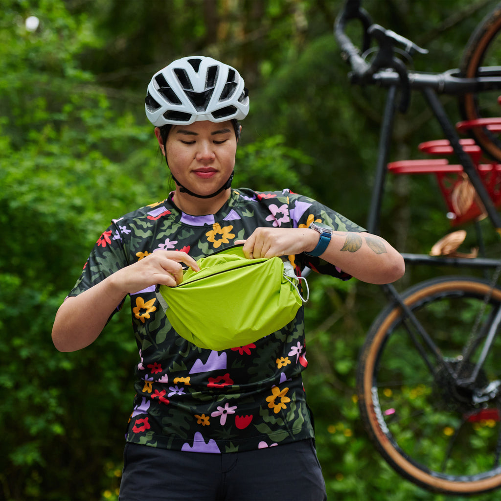 Women's Century Jacket, packed down small in a rider's hands