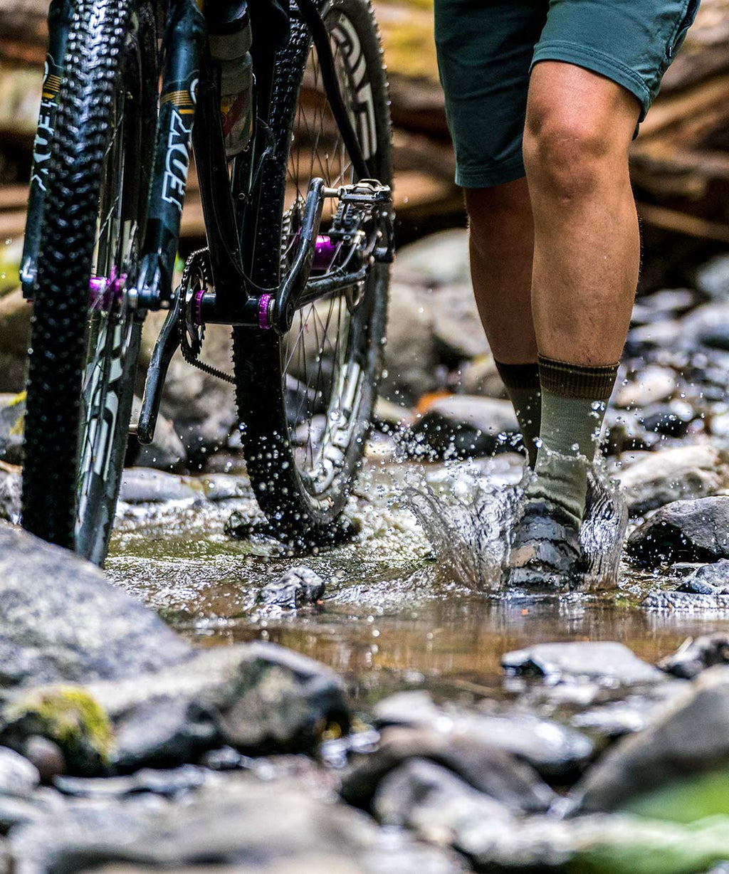 Cross Point Waterproof Socks: Mountain, worn standing in a stream next to a mountain bike