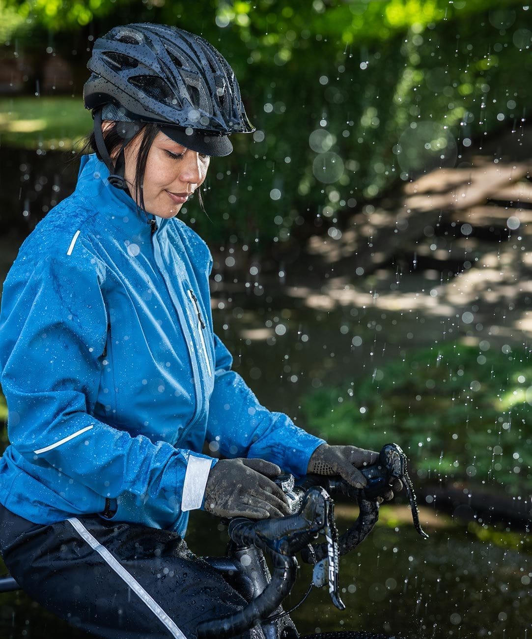 Cross Point Waterproof Knit Gloves: Pro Wool, worn by a rider in a blue jacket in the rain