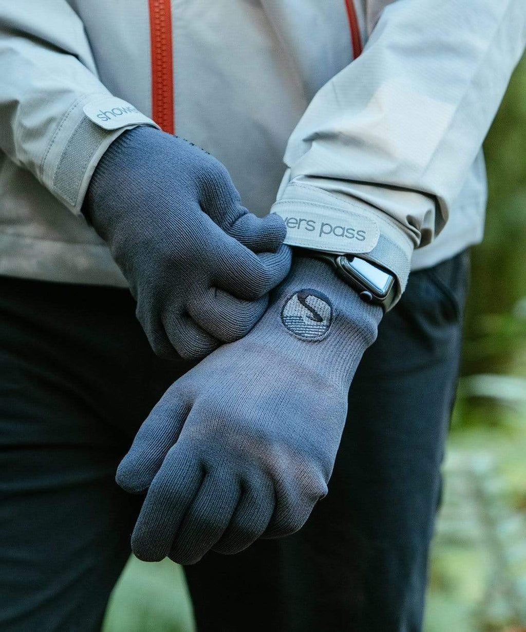 Cross Point Waterproof Knit Gloves: Pro Wool, gray, being pulled on at the cuff