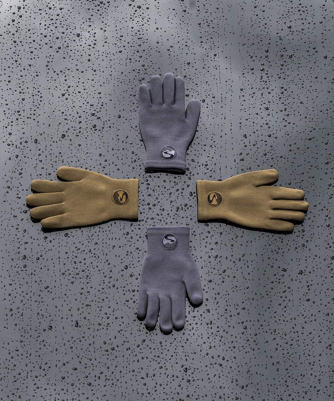 Cross Point Waterproof Knit Gloves: Pro Wool, gray and tan gloves laid out on a wet surface