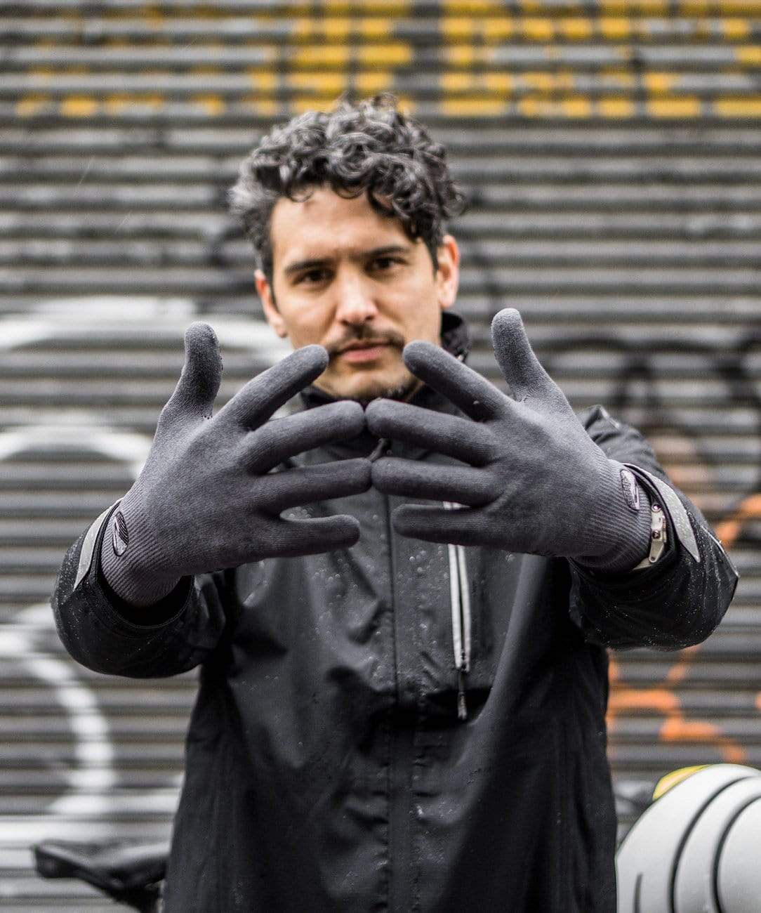 Cross Point Waterproof Knit Gloves: Pro Wool, gray, worn by a rider holding up both hands