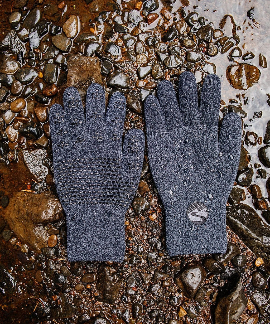 Cross Point Waterproof Knit Gloves: Pro Wool, gray pair laid on wet gravel