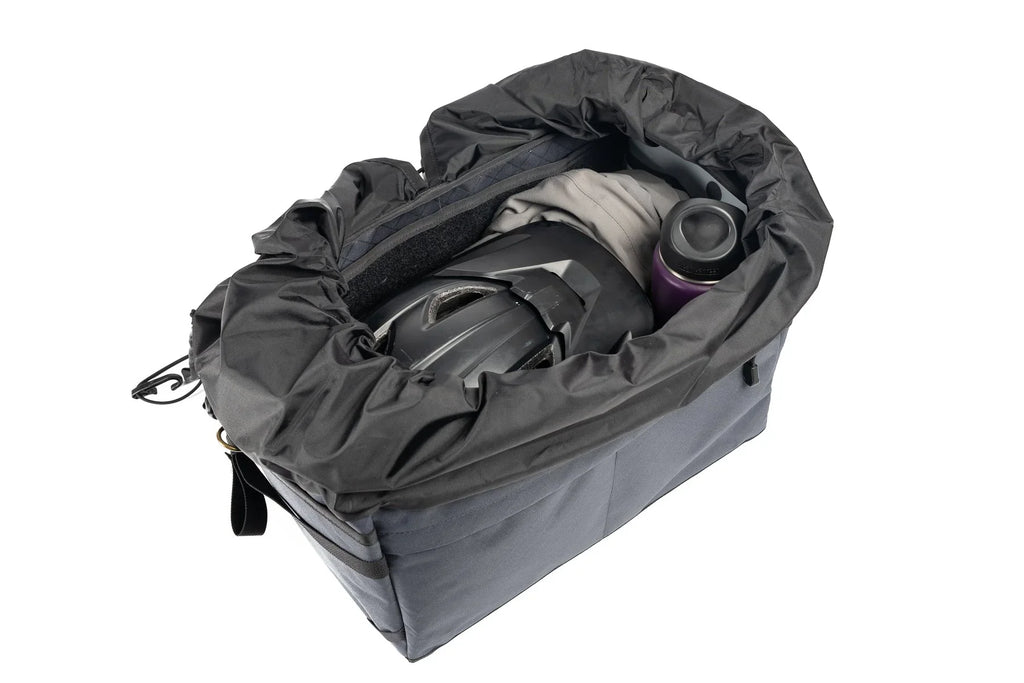 Outer Shell Rack Bag, open with a helmet and gear inside