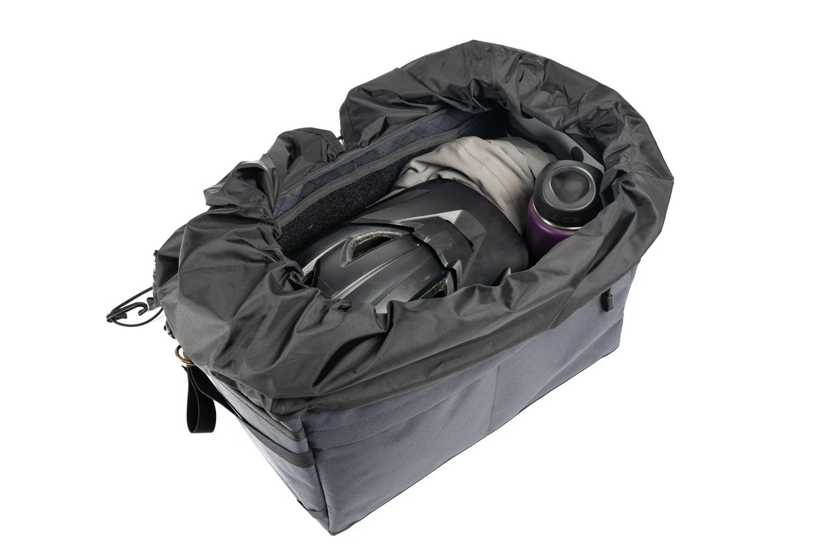 Outer Shell Rack Bag, open with a helmet and gear inside