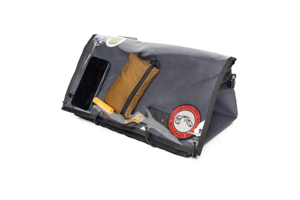 Outer Shell Rack Bag, clear top flap with phone and wallet underneath