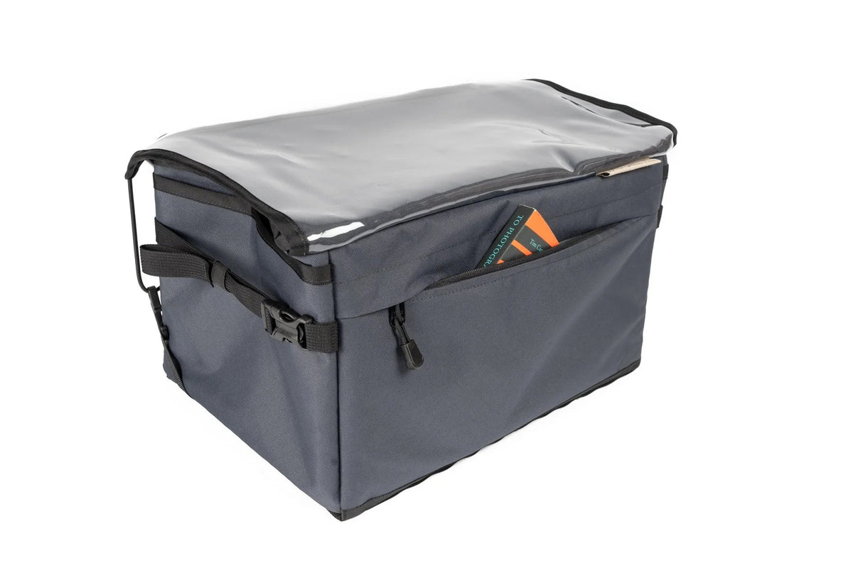 Outer Shell Rack Bag, gray, with items under the clear flap