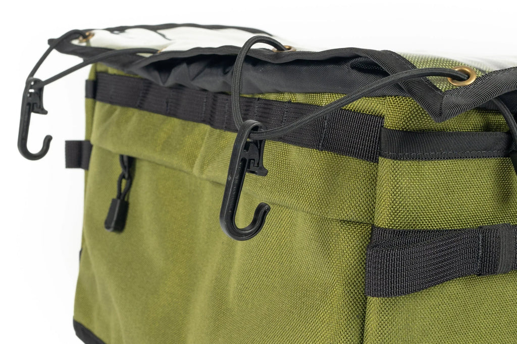 Outer Shell 137 Basket Bag, close-up of the bungee hooks and side pocket