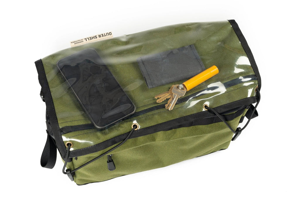 Outer Shell 137 Basket Bag, top view with phone and keys under the clear flap