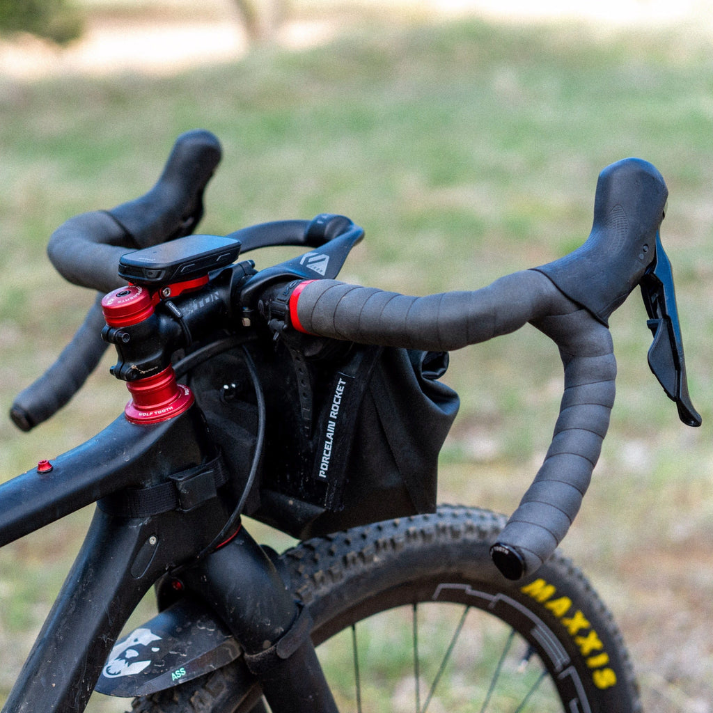 Wolf Tooth Supple Bar Tape, black tape on a gravel bike with a handlebar bag