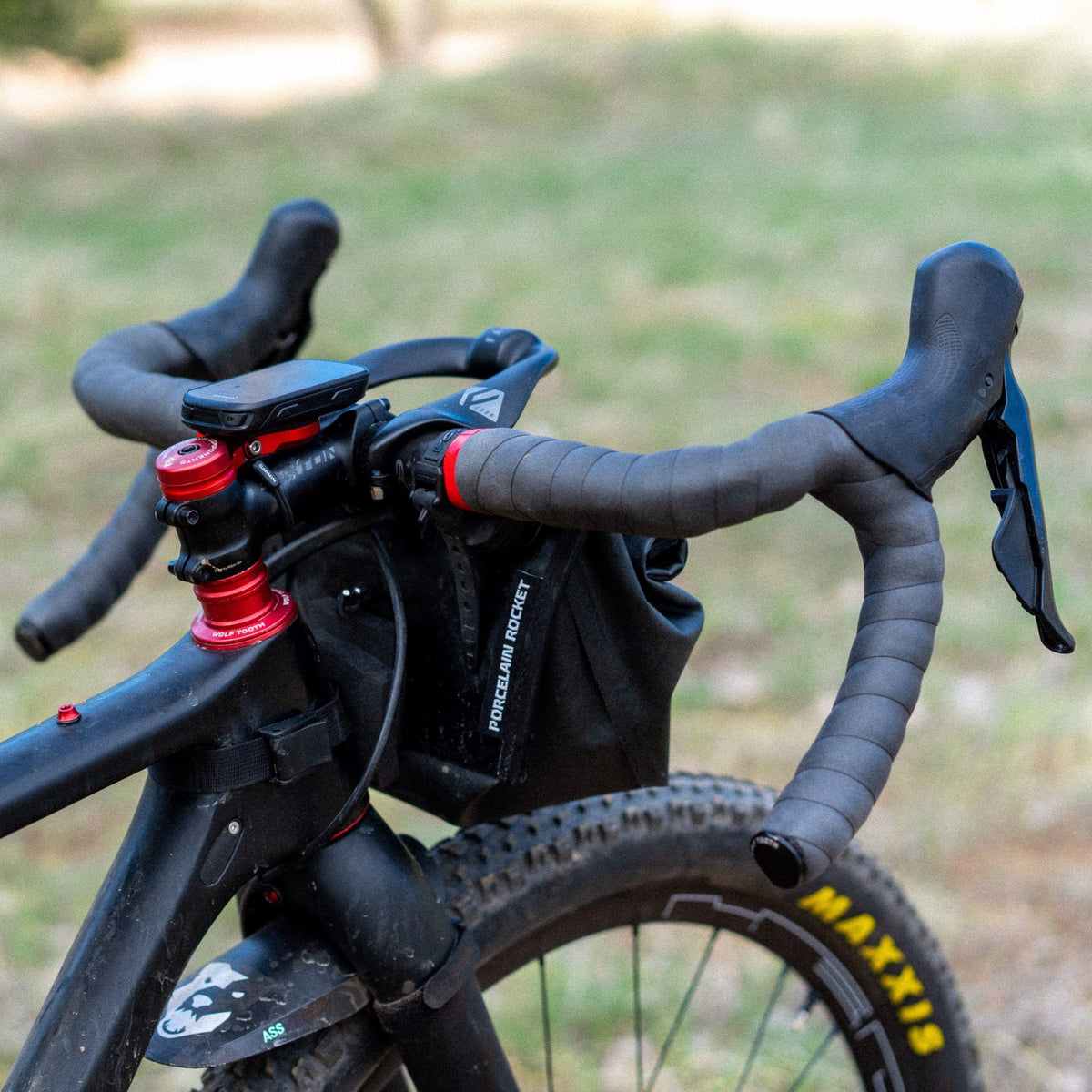 Wolf Tooth Supple Bar Tape, black tape on a gravel bike with a handlebar bag