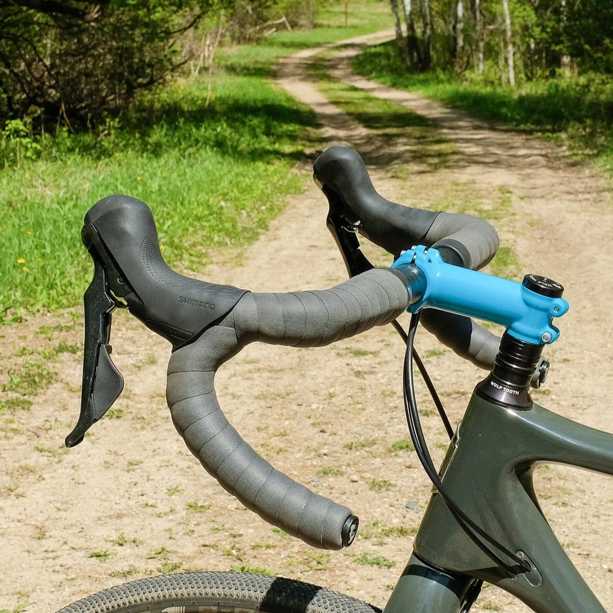 Wolf Tooth Supple Bar Tape, gray tape on a gravel bike handlebar