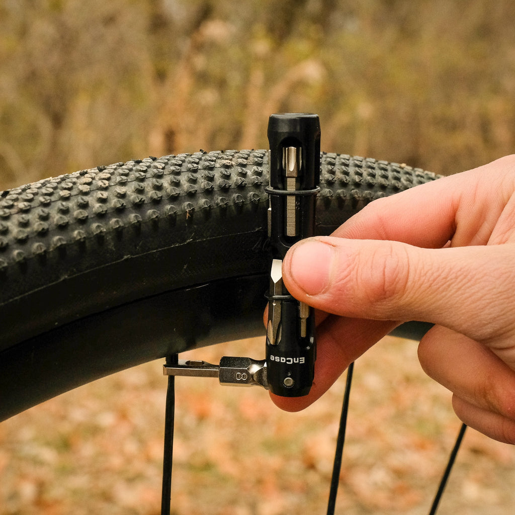 Wolf Tooth EnCase Hex Bit Wrench Multi-Tool, adjusting a spoke at the wheel