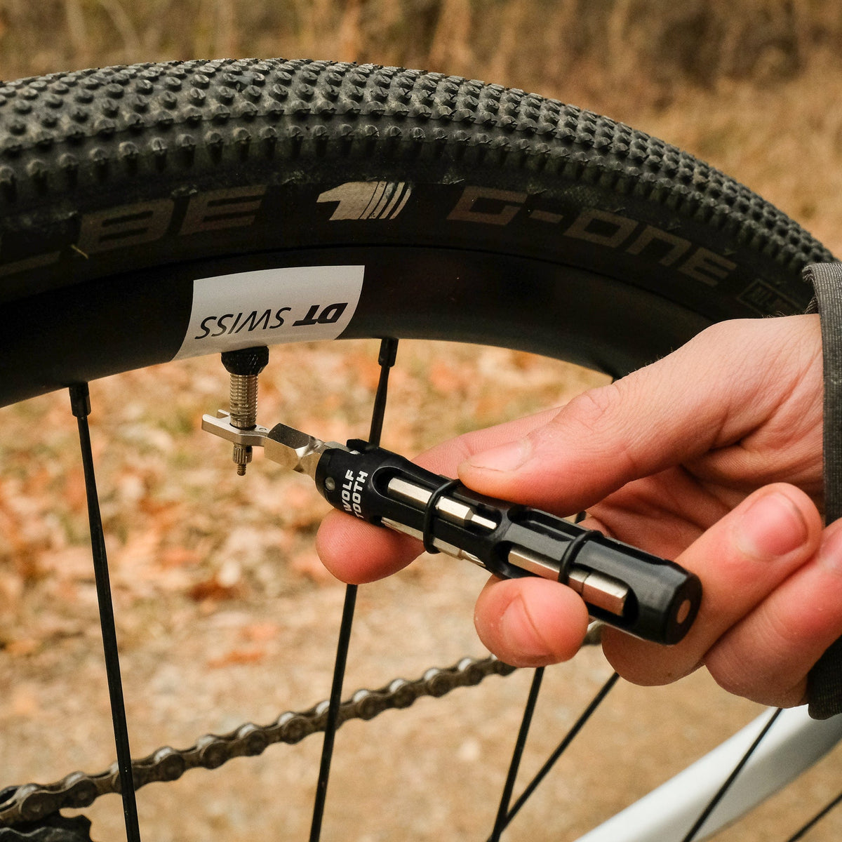 Wolf Tooth EnCase System Bar Kit One, using the valve core wrench at the wheel