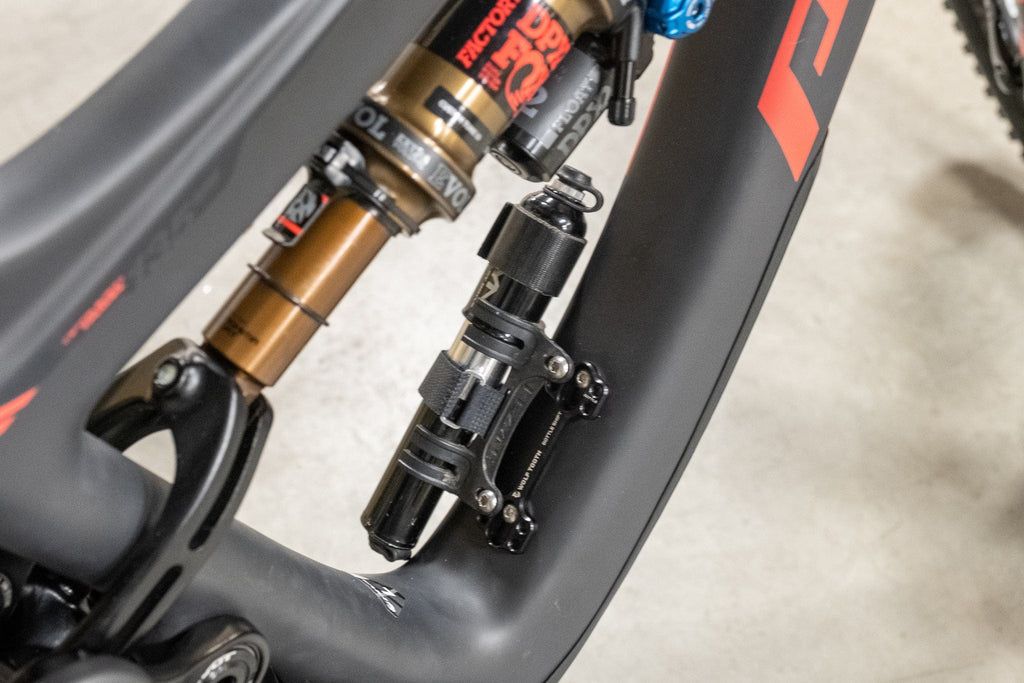 Wolf Tooth B-RAD Bottle Shift, on a full suspension frame near the shock