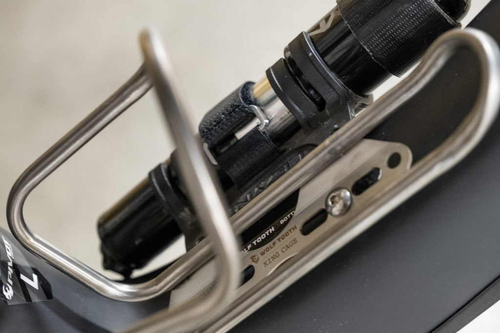Wolf Tooth B-RAD Bottle Shift, mounted under a bottle cage, close-up