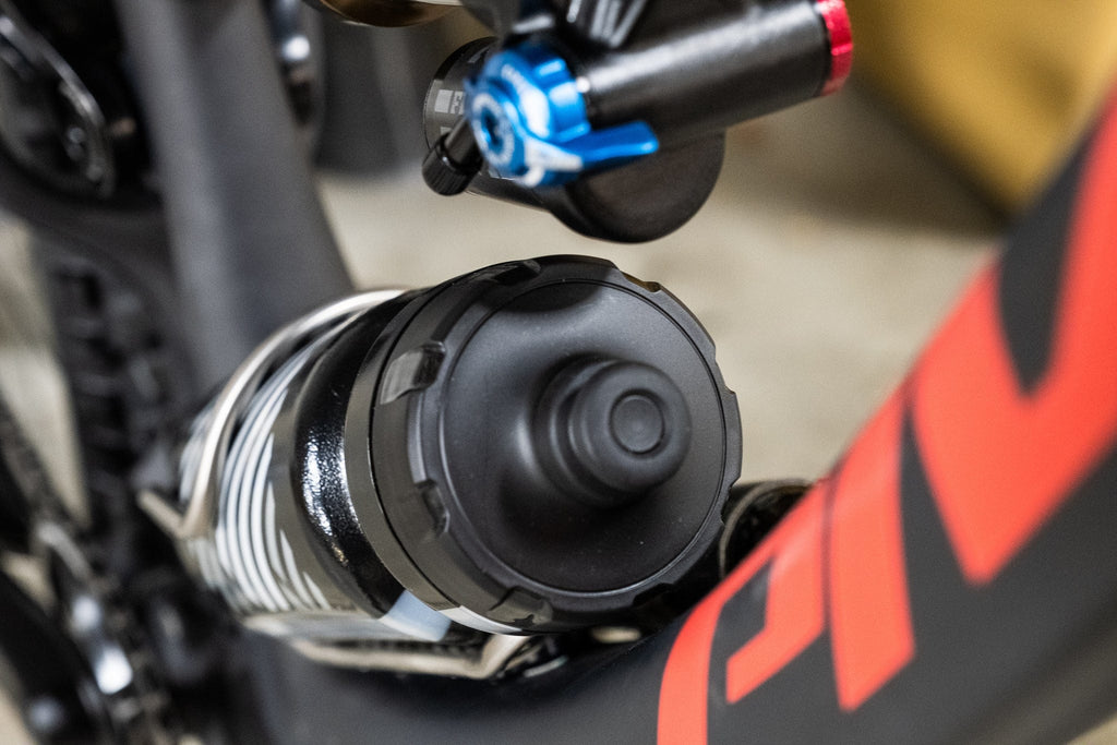 Wolf Tooth B-RAD Bottle Shift, bottle shifted to the side on a full suspension frame