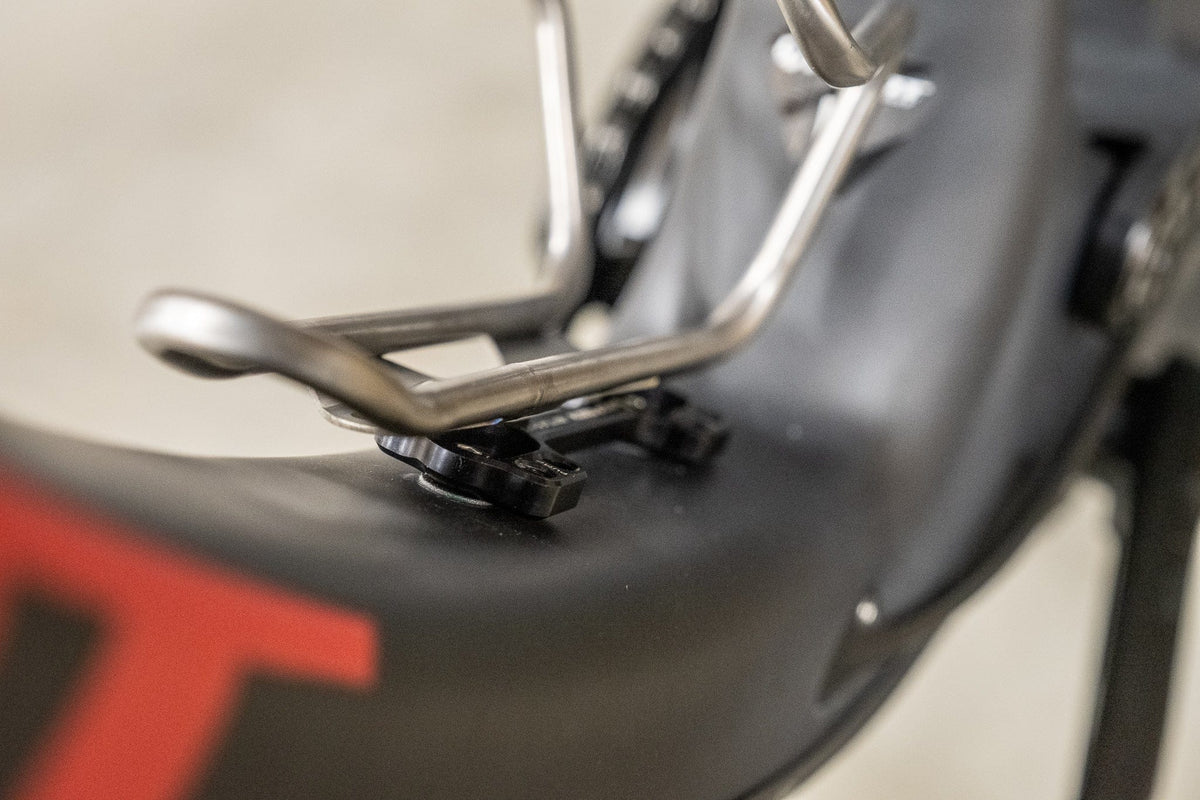Wolf Tooth B-RAD Bottle Shift, mounted on a frame with a bottle cage attached