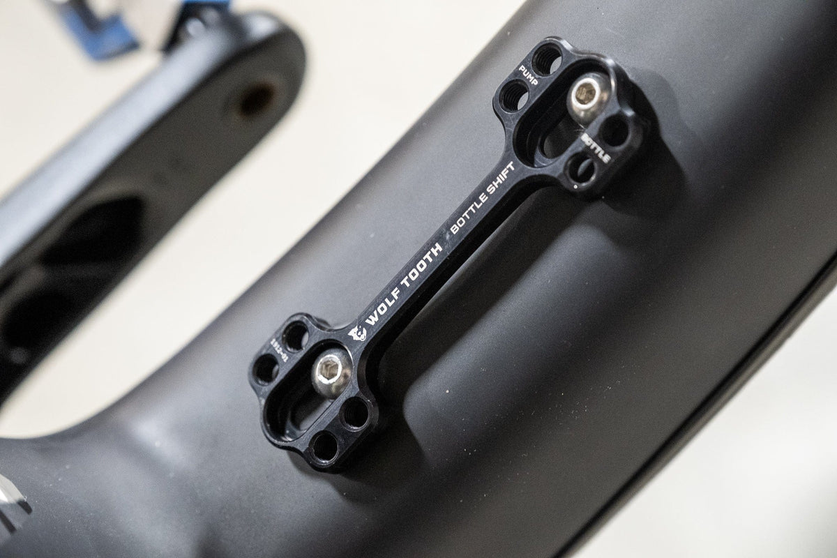 Wolf Tooth B-RAD Bottle Shift, mounted on a carbon frame