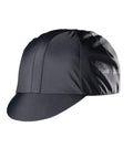 Black Showers Pass Elite cycling cap, three-quarter front view with the short brim turned down and the wordmark on the side panel.