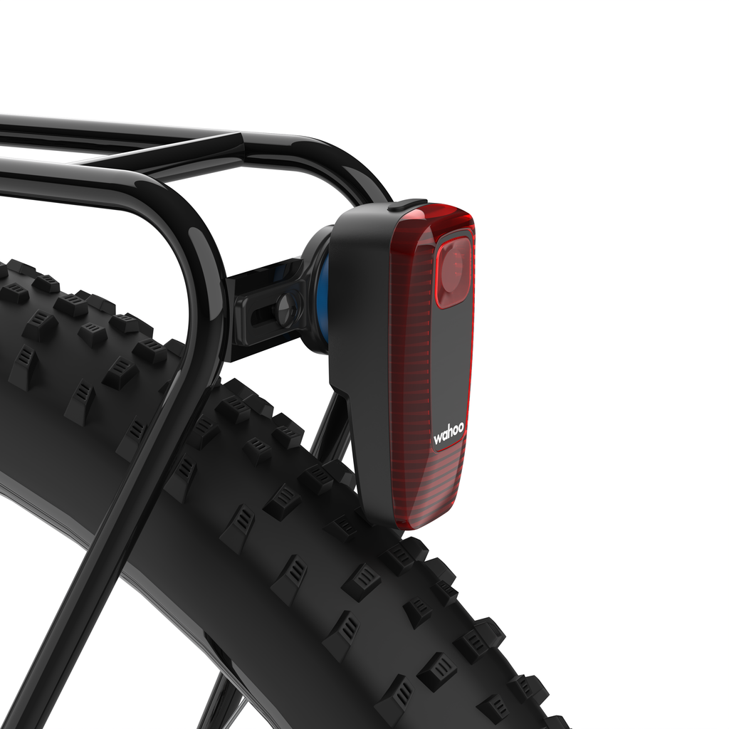 KOM Rear Rack Radar Mount for Garmin Varia, on a rear rack with a radar tail light attached, close-up