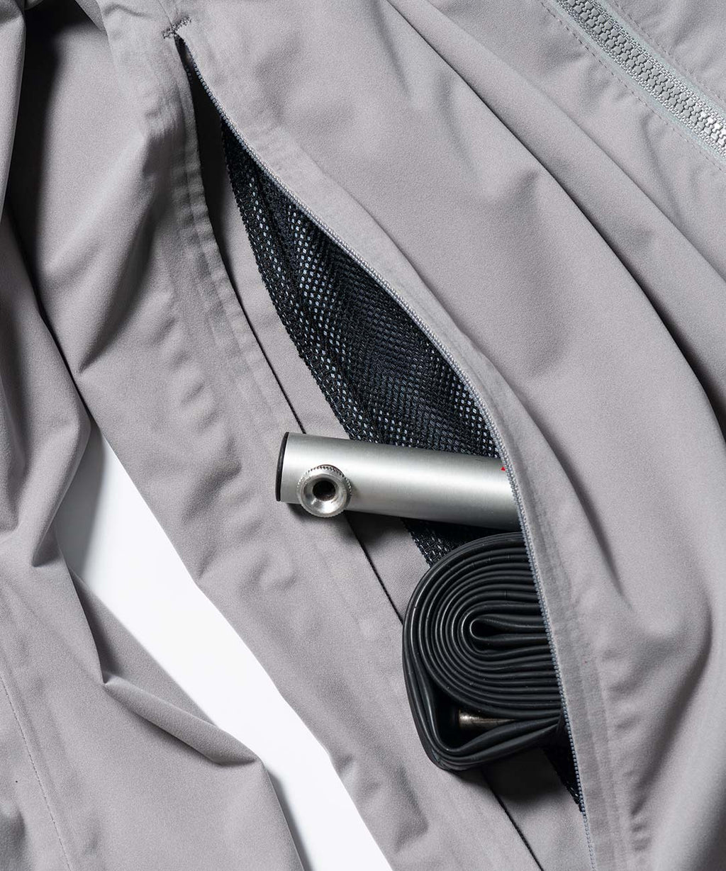 Men's Cloudburst Jacket, close-up of the back pocket holding a tube and CO2
