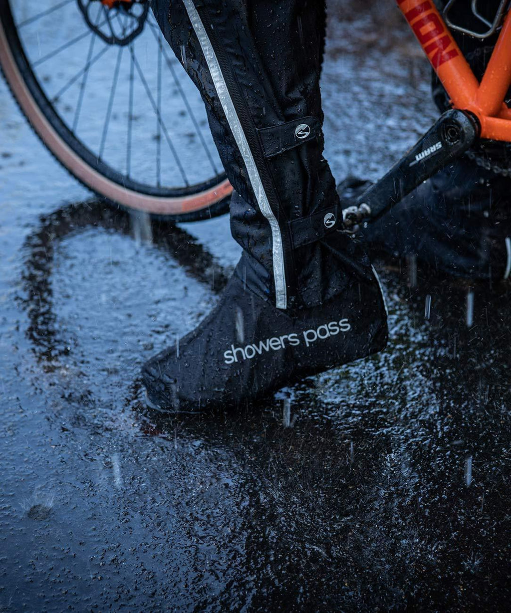 Club Waterproof Shoe Covers, worn while stepping in a puddle