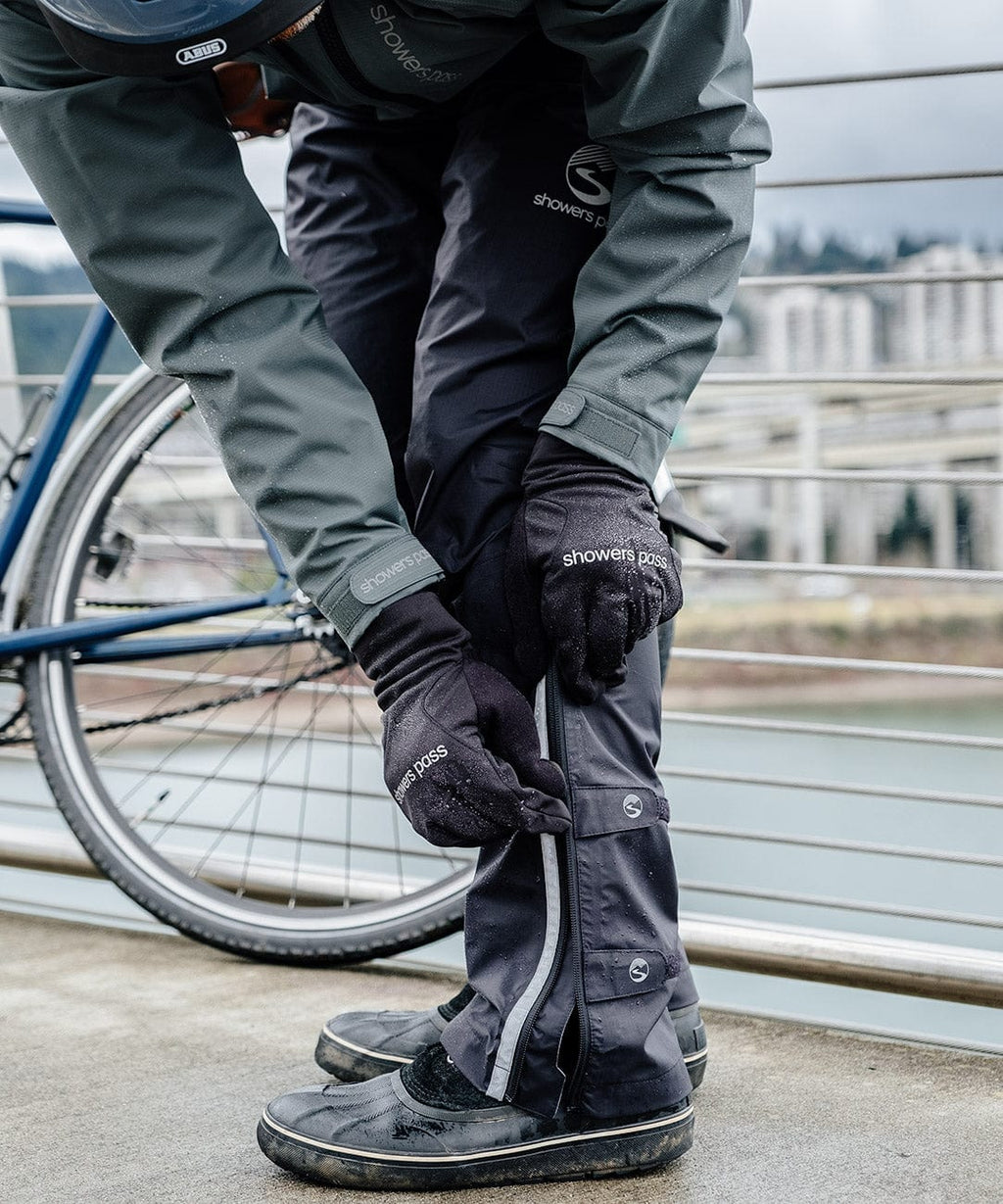 Men's Transit Pant, rider adjusting the ankle cuff