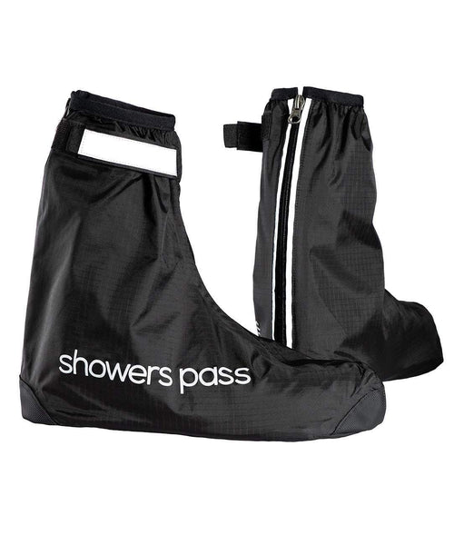Pair of black Showers Pass Club waterproof shoe covers, one side on with the wordmark, the other from behind showing the reflective rear zip and tab.