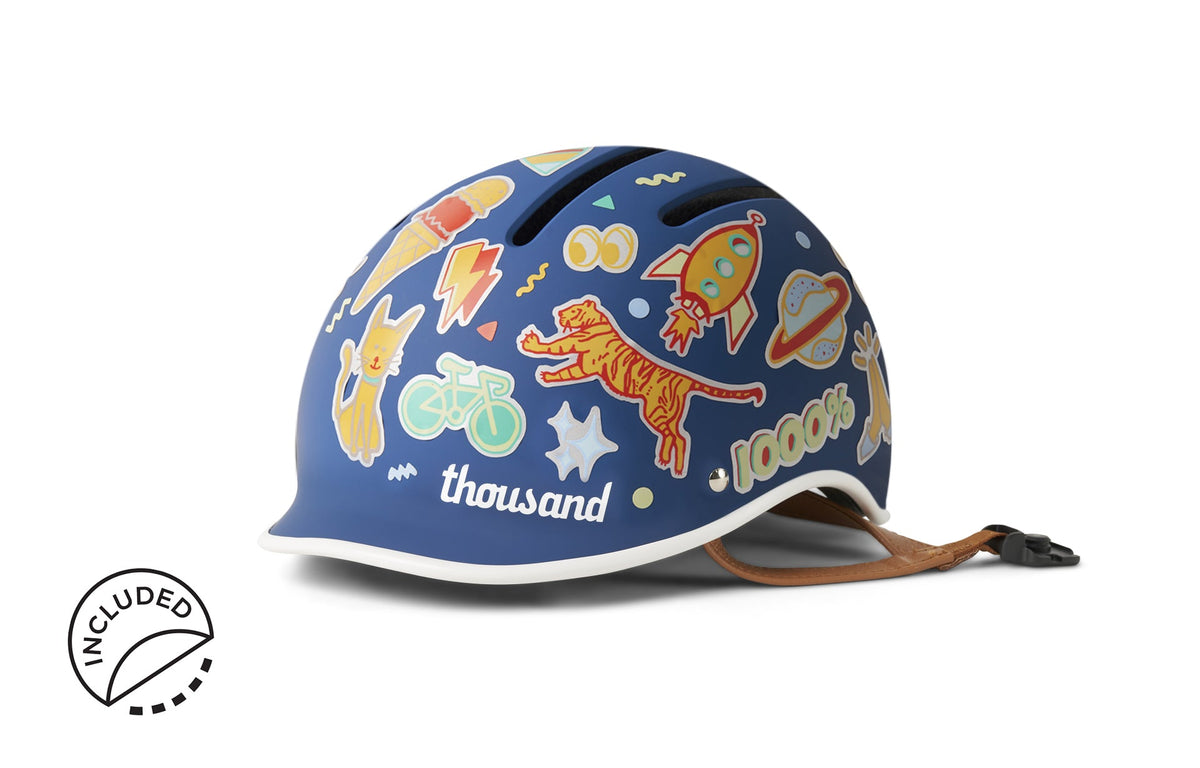 Thousand Jr. kids helmet in Blazing Blue with reflective stickers