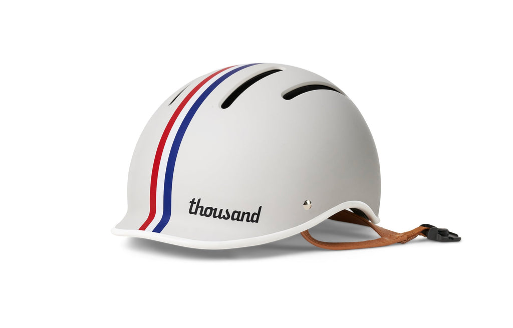 Thousand Jr. Kids Helmet, white with red and blue stripes, front angle