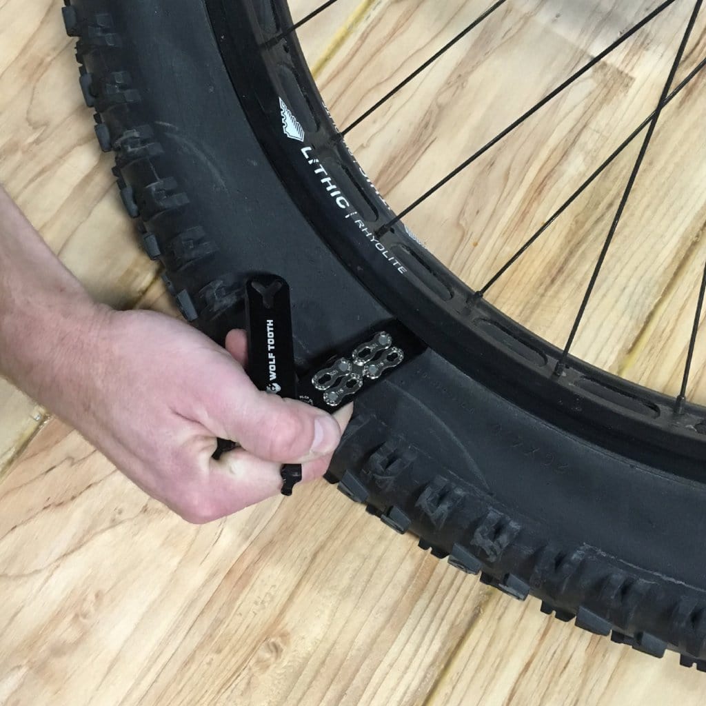 Wolf Tooth Pack Pliers, used as a tire lever