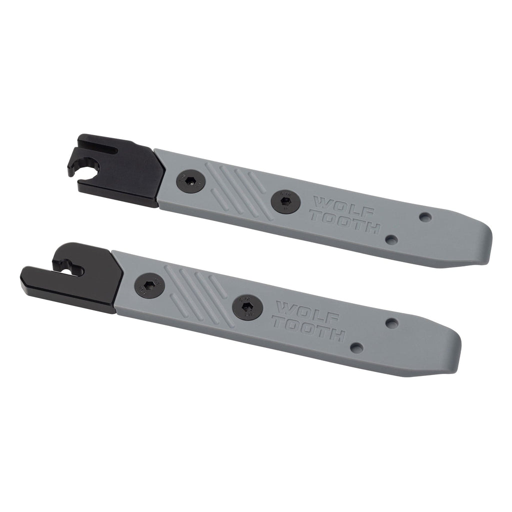 Pair of Wolf Tooth 8-Bit tire levers in grey, one with an integrated multi-tool