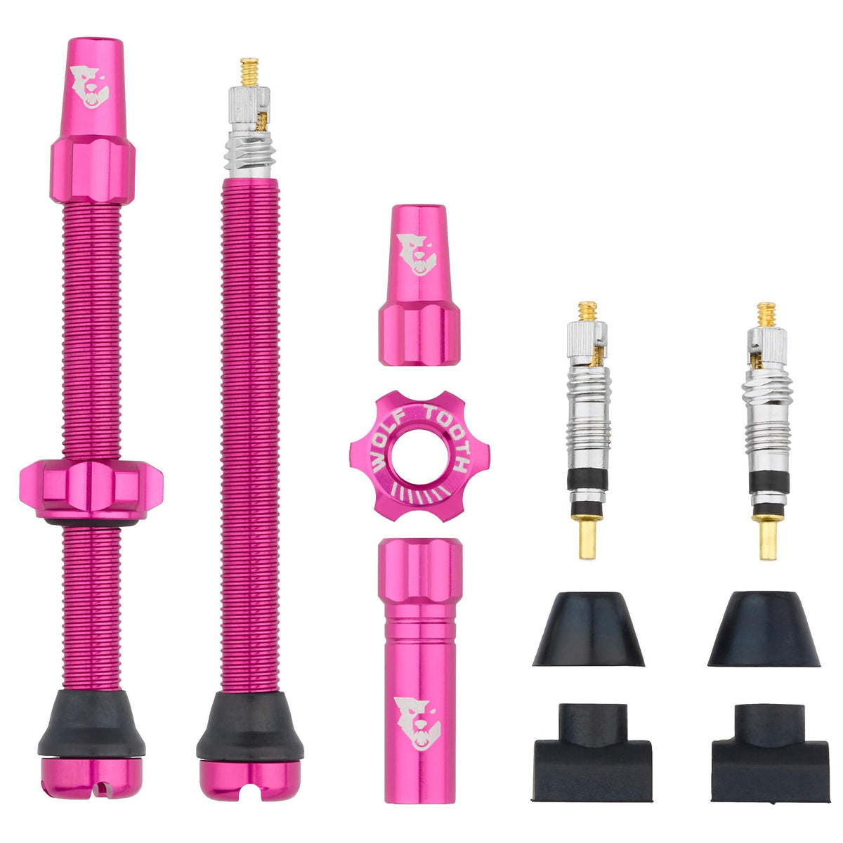Wolf Tooth tubeless Presta valve stems in pink with spare cores, caps and rubber seals
