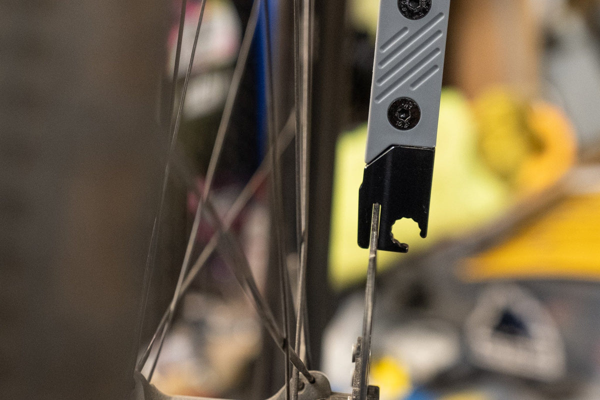 Wolf Tooth 8-Bit Tire Lever Kit One, adjusting a spoke with the tool