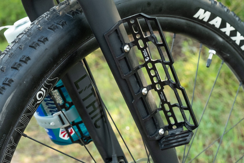 Wolf Tooth Morse Cargo Cage, black, mounted on a fork leg