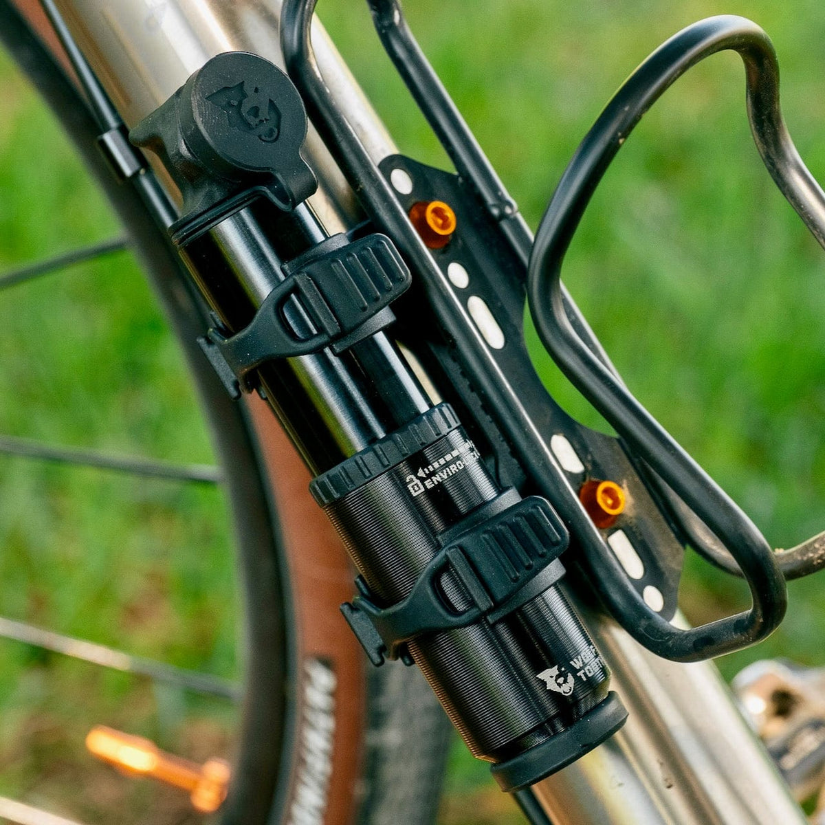 Wolf Tooth EnCase Pump 40cc, mounted next to a bottle cage on a bike
