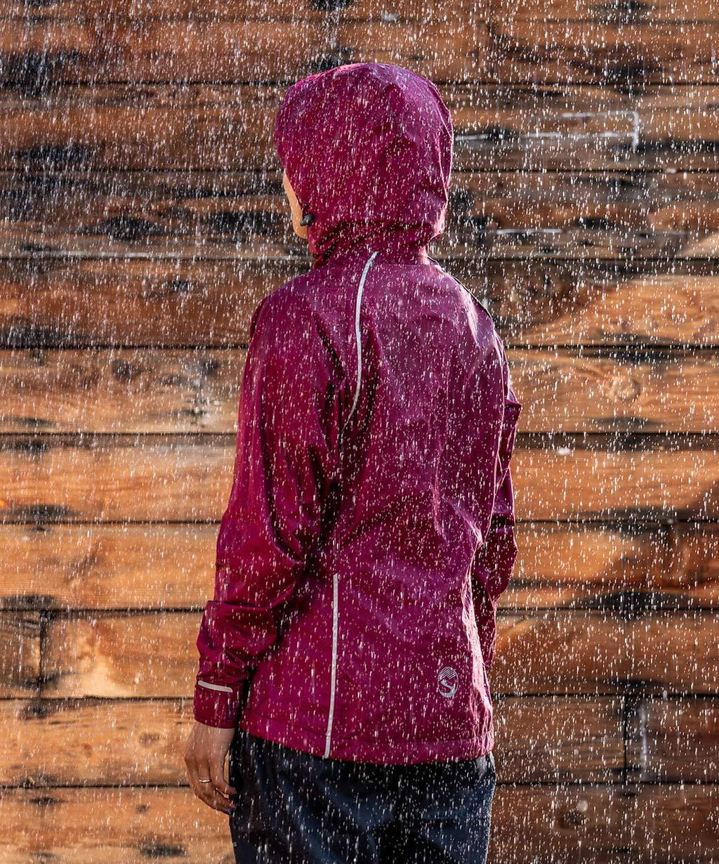 Women's Syncline CC Jacket, red, hood up in the rain, seen from behind